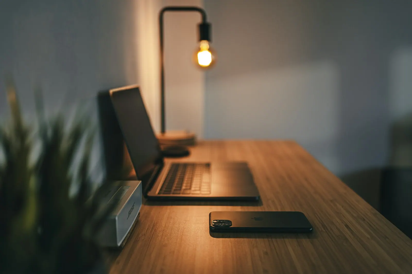 A desk in warm light — the planned atmosphere, not a finished interior.